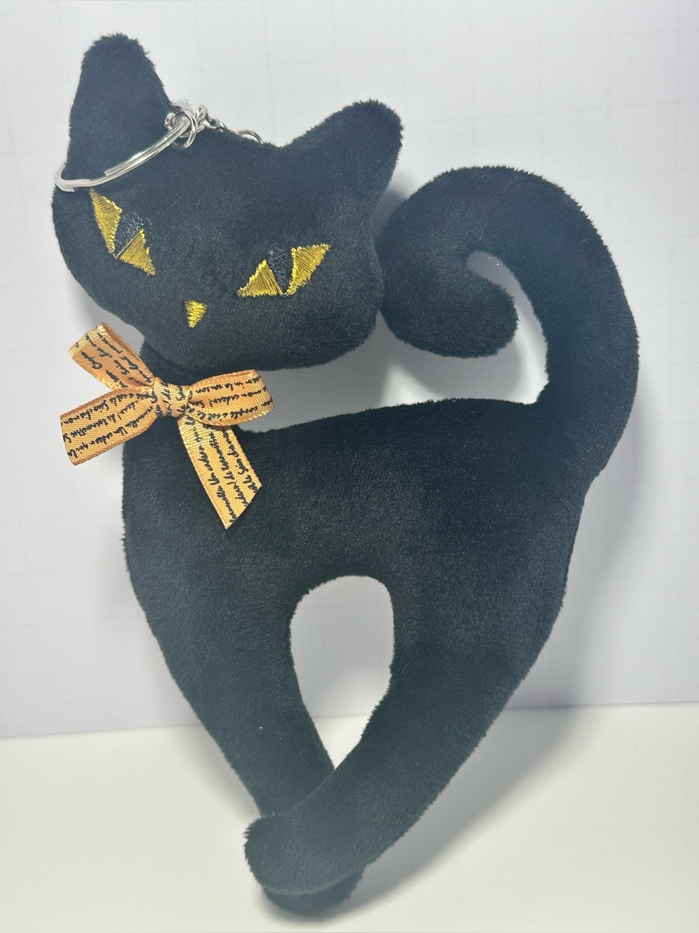 Black Plush Cat Keychain with Gold Eyes and Bow